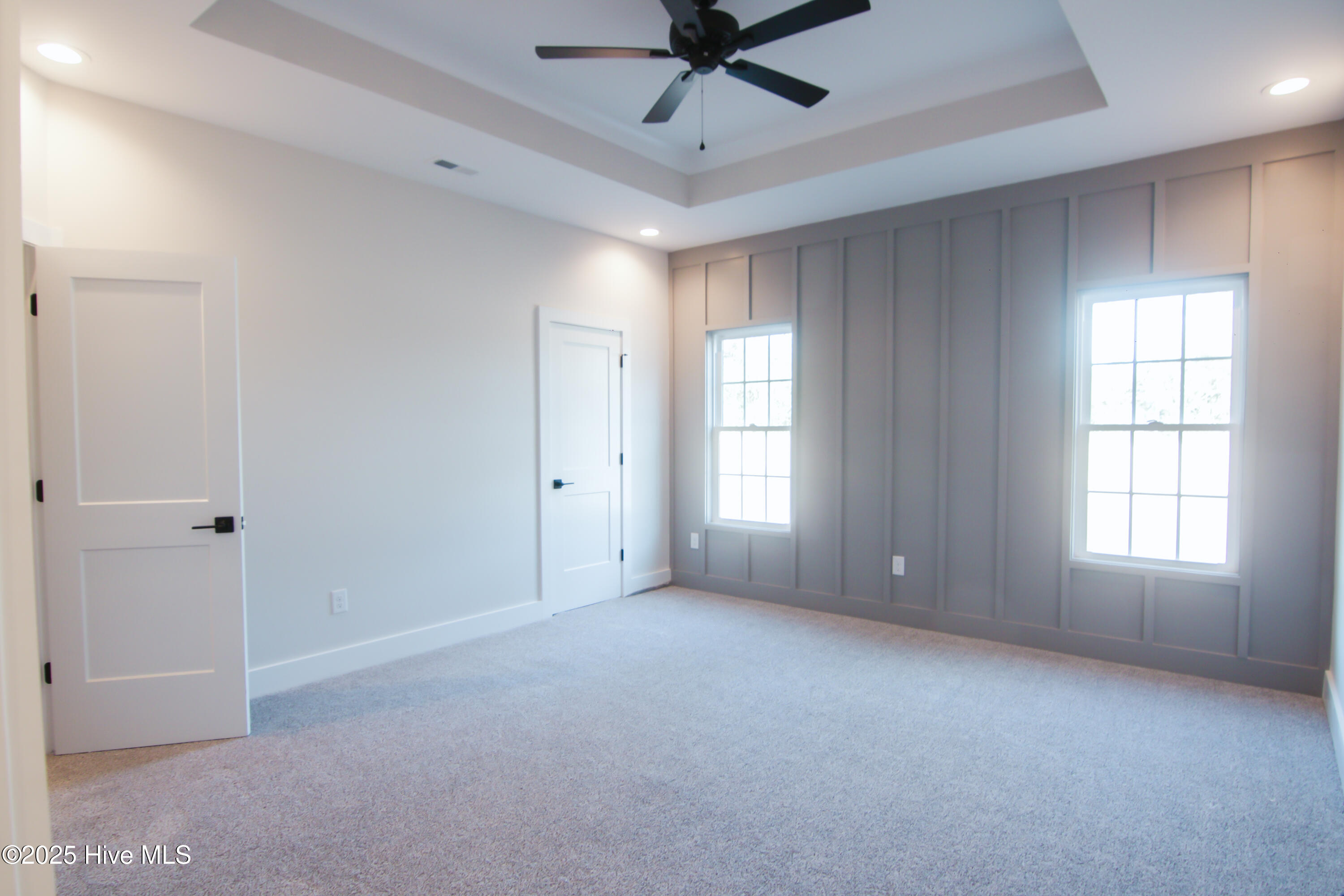 578 Forest Knolls Road Goldsboro, NC 27534 - Photo 15 of 22 Master bedroom with accent wall and tray ceiling