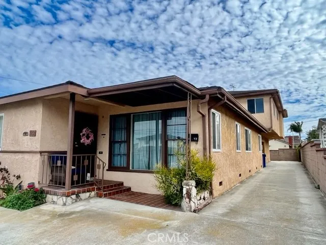 front view of a house with a small yard