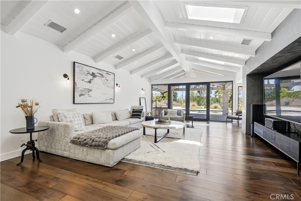 24884 Jim Bridger Road Hidden Hills, CA 91302 - Photo 11 of 31 a living room with furniture and a large window