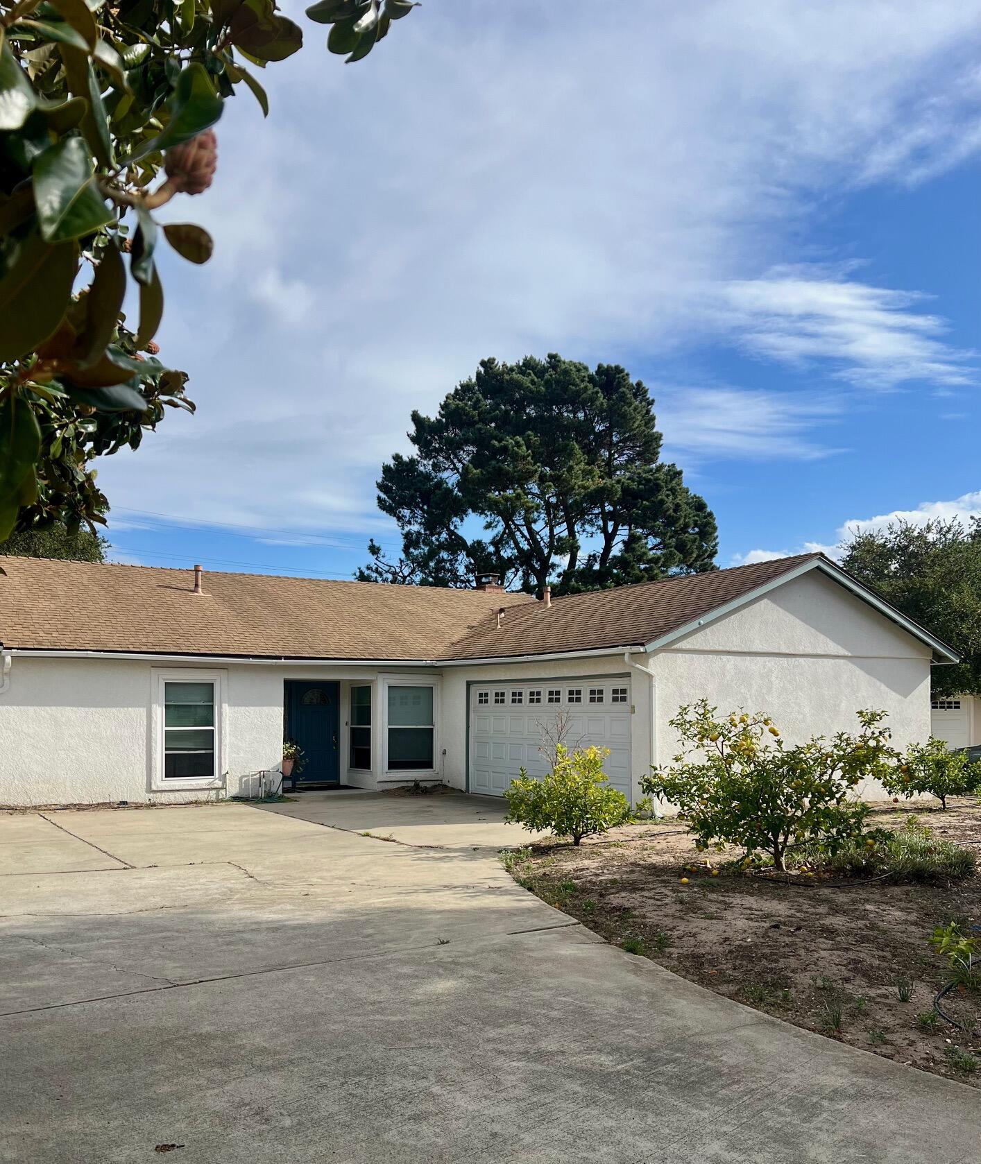 front view of a house with a dry yard