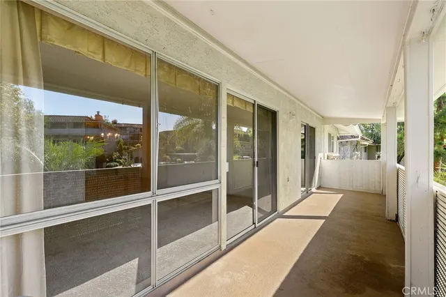 a bathroom with a glass door shower and sink