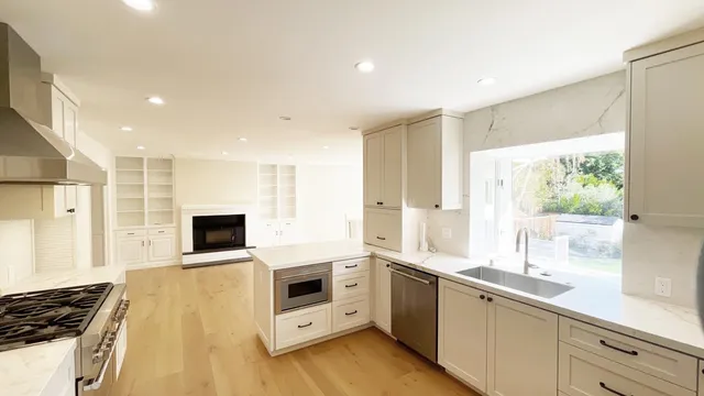 a kitchen with cabinets and white appliances