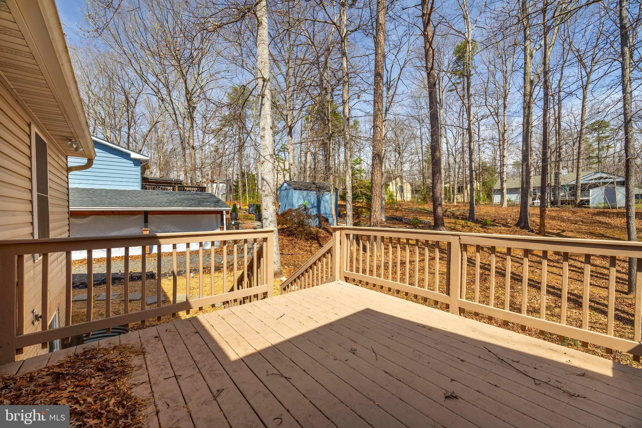 203 Birdie Road Locust Grove, VA 22508 - Photo 14 of 46 a view of a balcony with wooden floor and fence