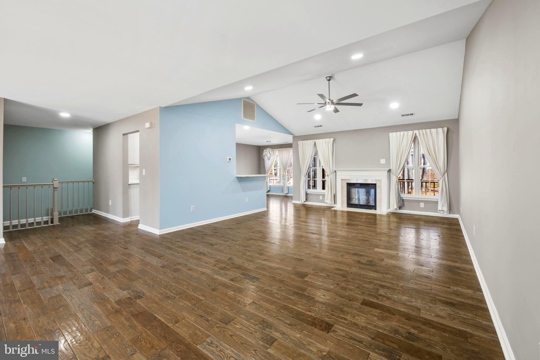 203 Birdie Road Locust Grove, VA 22508 - Photo 3 of 46 a view of an empty room with a fireplace and a window