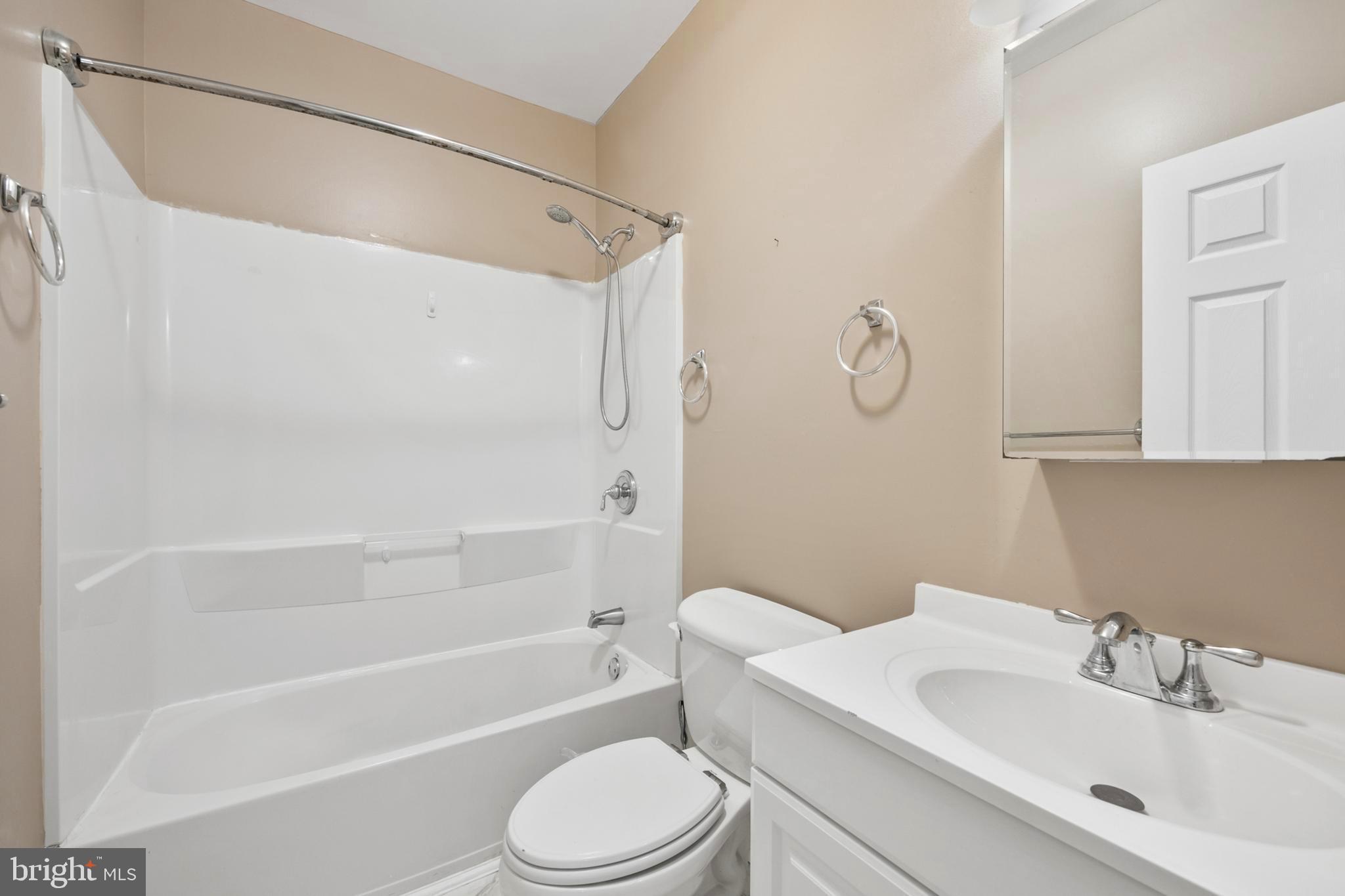 203 Birdie Road Locust Grove, VA 22508 - Photo 33 of 46 a bathroom with a sink toilet and shower