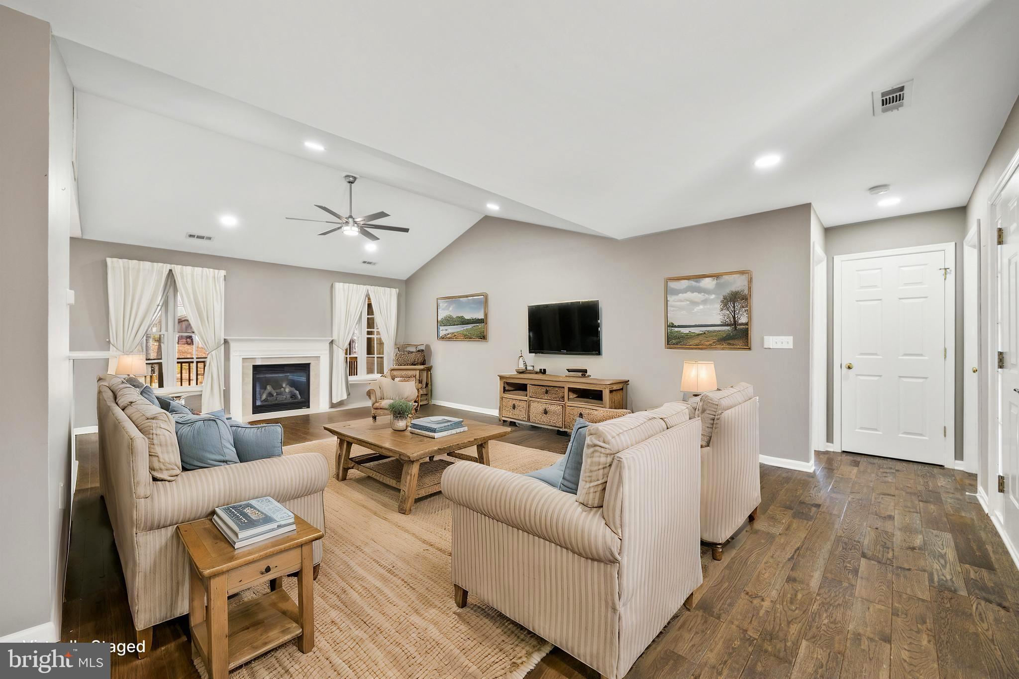 203 Birdie Road Locust Grove, VA 22508 - Photo 5 of 46 a living room with furniture a fireplace and a flat screen tv
