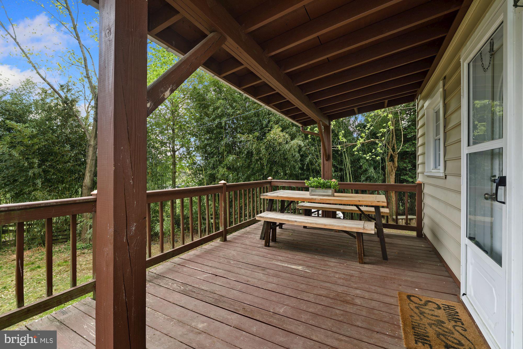 7036 Warfield Road Gaithersburg, MD 20882 - Photo 11 of 30 Enjoy Dinner Al Fresco on Your Covered Deck