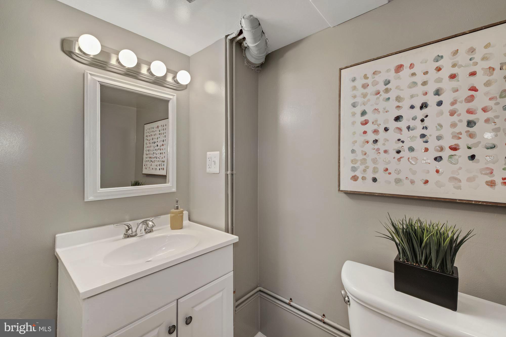 7036 Warfield Road Gaithersburg, MD 20882 - Photo 22 of 30 Adjacent Half Bath