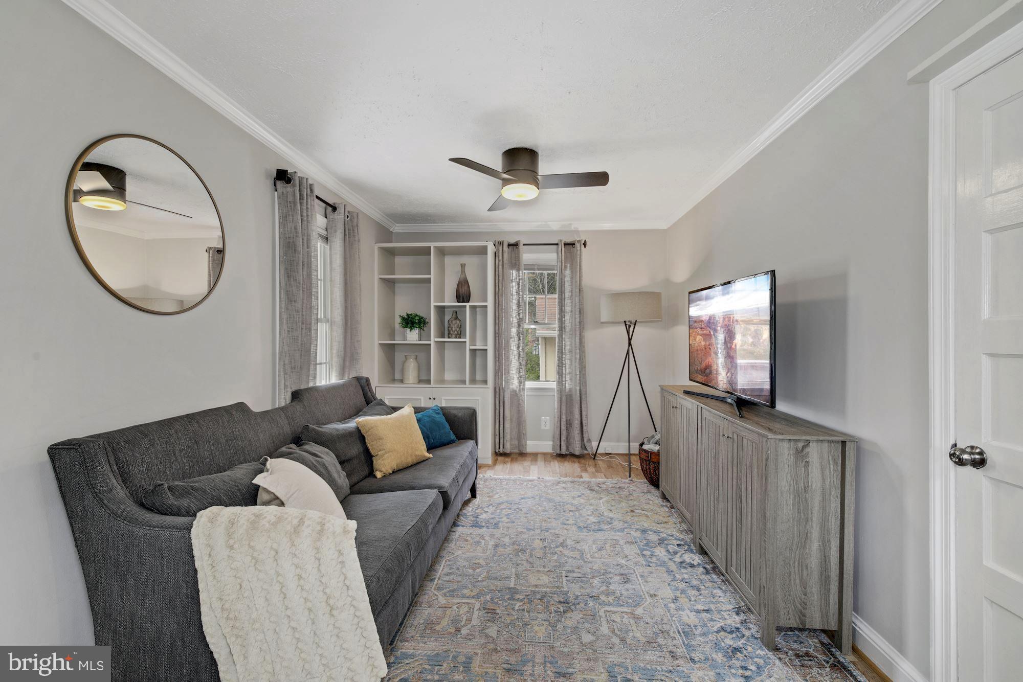 7036 Warfield Road Gaithersburg, MD 20882 - Photo 7 of 30 Cozy Living Room with Built-Ins