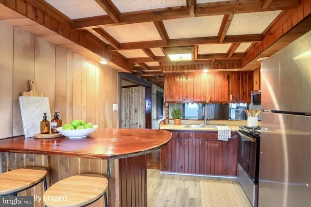 a kitchen with a refrigerator and countertop