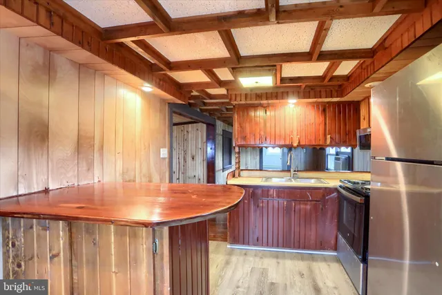 a bathroom with a sink and a large window