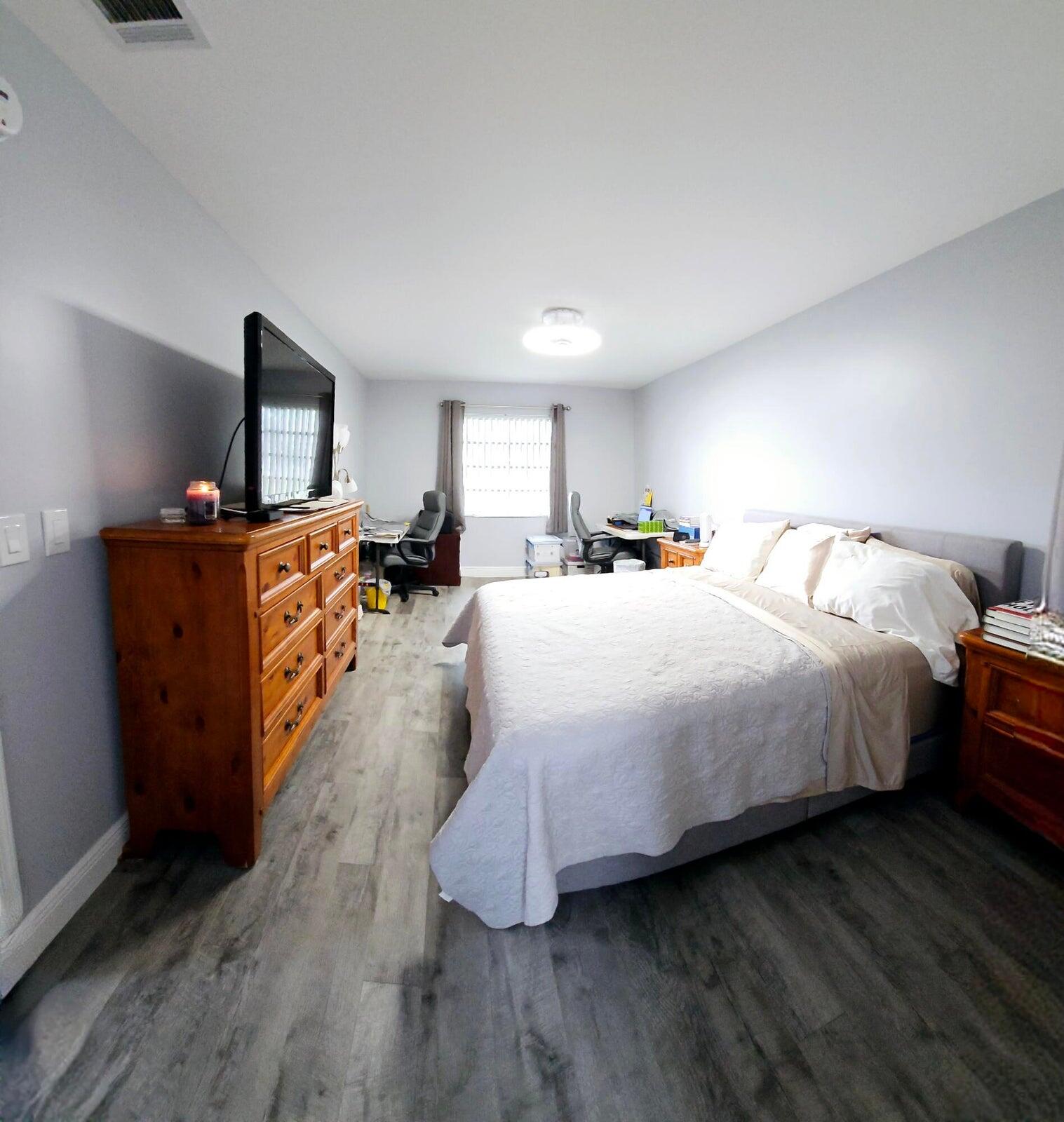 10126 South 44th Terrace Boynton Beach, FL 33436 - Photo 13 of 30 a bed room with a bed and a tv