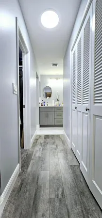 a room with a sink and a mirror