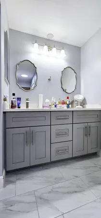 a bathroom with a double vanity sink and a mirror