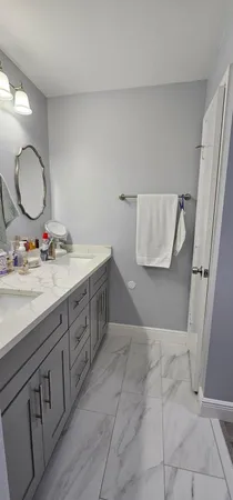 a bathroom with a toilet and a shower curtain