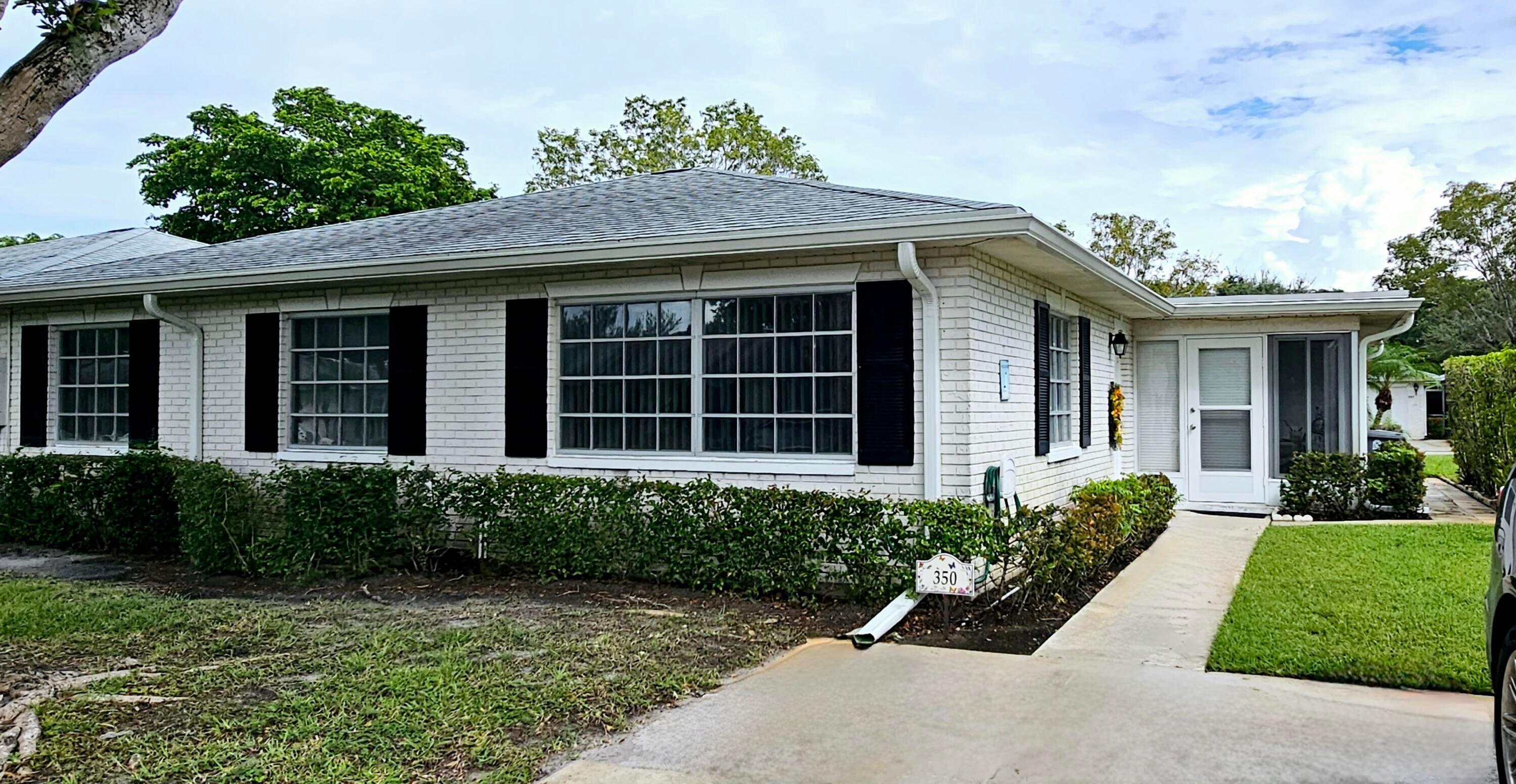 10126 South 44th Terrace Boynton Beach, FL 33436 - Photo 30 of 30 front view of a house with a yard