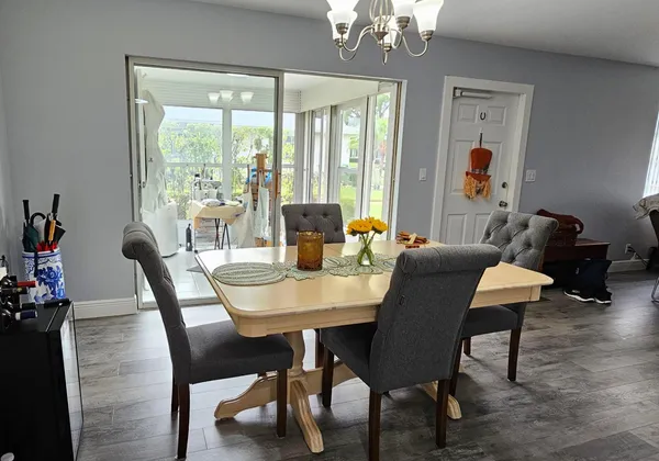 a view of a dining room with furniture window and outside view