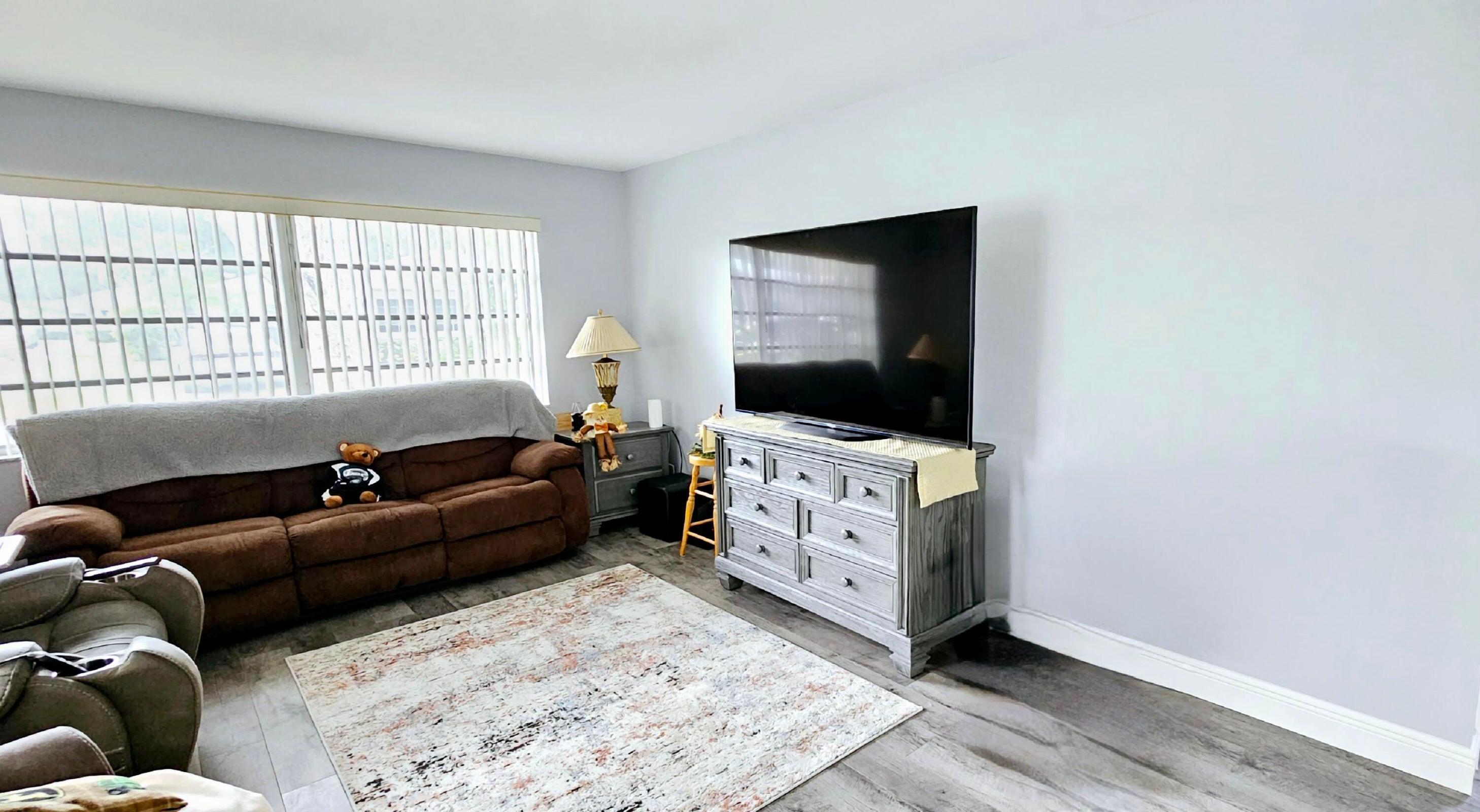 10126 South 44th Terrace Boynton Beach, FL 33436 - Photo 7 of 30 a living room with furniture and a flat screen tv