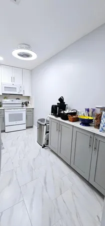 a kitchen with stainless steel appliances a sink and cabinets