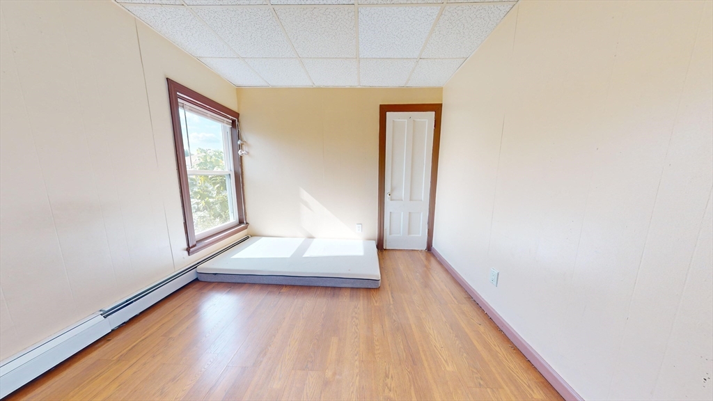 1022 Main Street Worcester, MA 01603 - Photo 12 of 40 a view of entryway with wooden floor