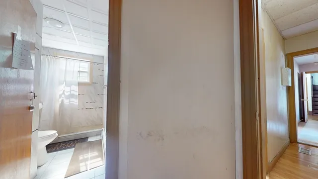 a bathroom with a glass shower door