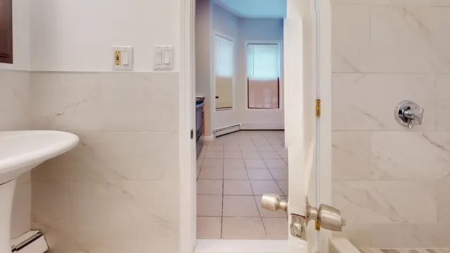 a bathroom with a sink and shower