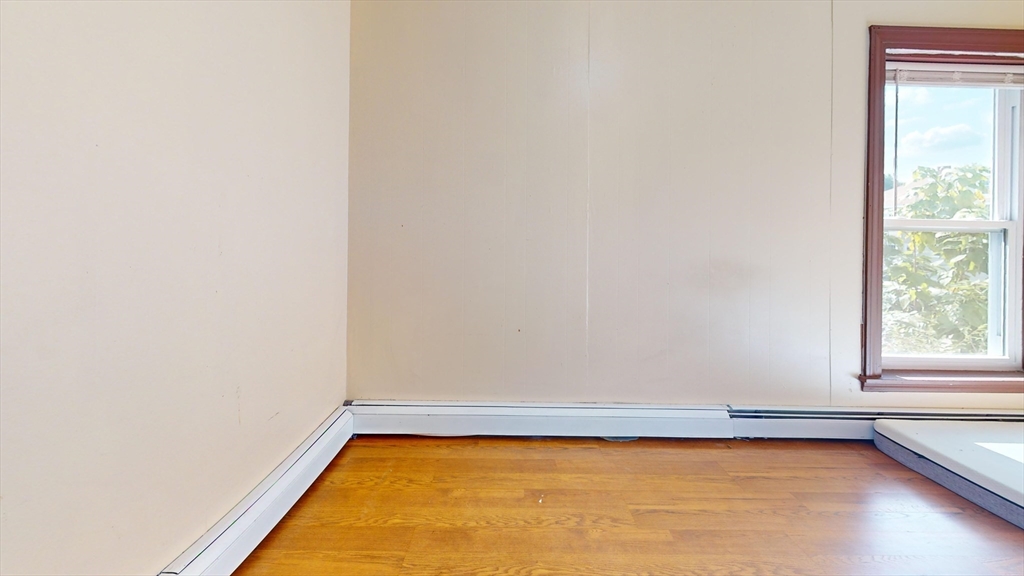 1022 Main Street Worcester, MA 01603 - Photo 31 of 40 a view of a room with an empty space and a window