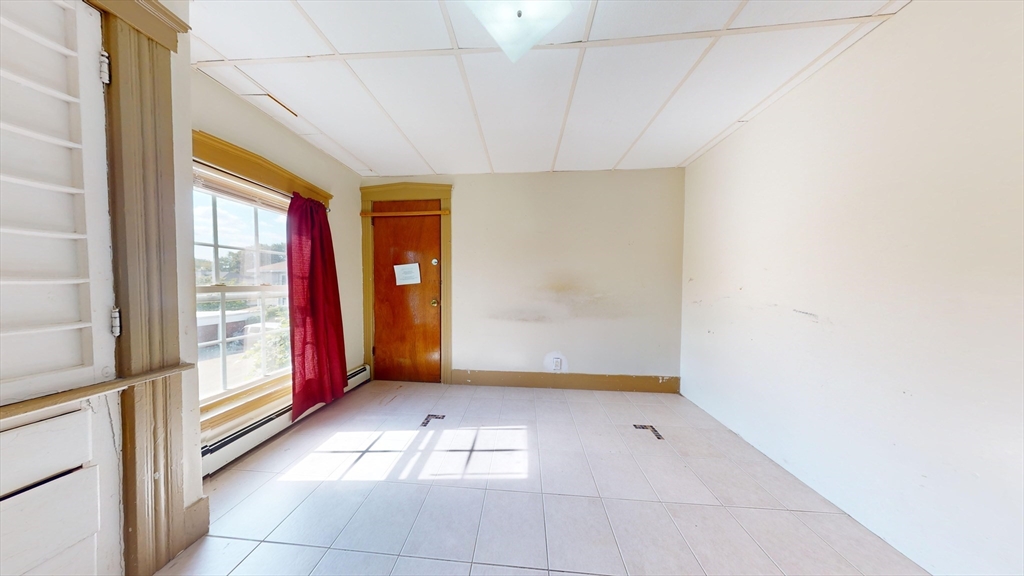 1022 Main Street Worcester, MA 01603 - Photo 6 of 40 a view of an empty room with window