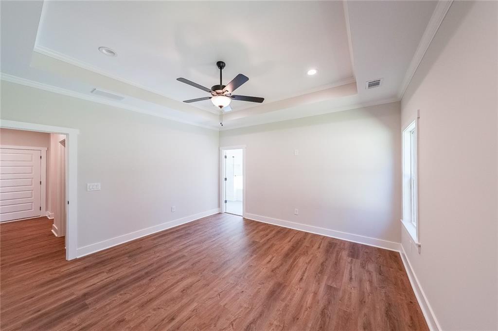 3300 Holly Springs Road Rockmart, GA 30153 - Photo 20 of 38 an empty room with wooden floor and windows