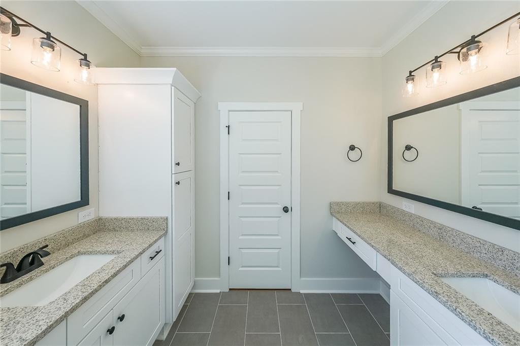 3300 Holly Springs Road Rockmart, GA 30153 - Photo 24 of 38 a bathroom with a granite countertop sink and a mirror