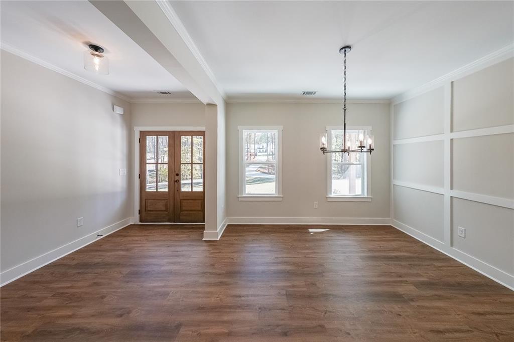 3300 Holly Springs Road Rockmart, GA 30153 - Photo 29 of 38 a view of an empty room with wooden floor and a window