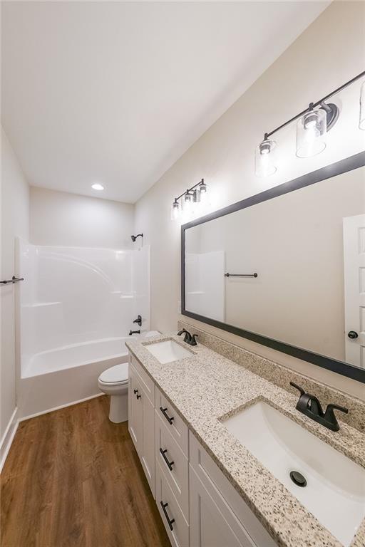 3300 Holly Springs Road Rockmart, GA 30153 - Photo 32 of 38 a bathroom with a granite countertop sink mirror and a bathtub