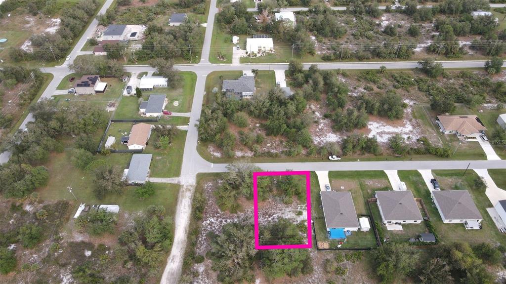 2265 Firestone Drive Punta Gorda, FL 33983 - Photo 6 of 10 a view of swimming pool with a yard and plants