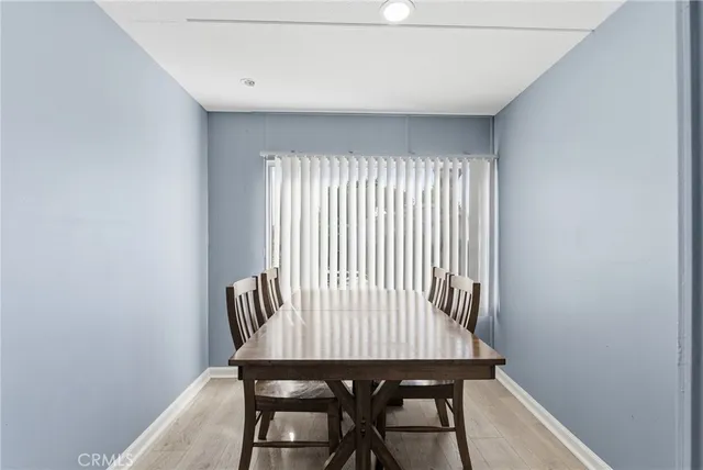a view of a room with a wooden table and chair
