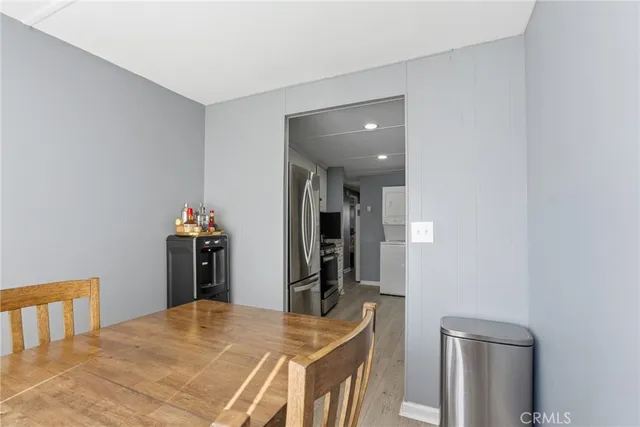 a bedroom with a bed and a mirror