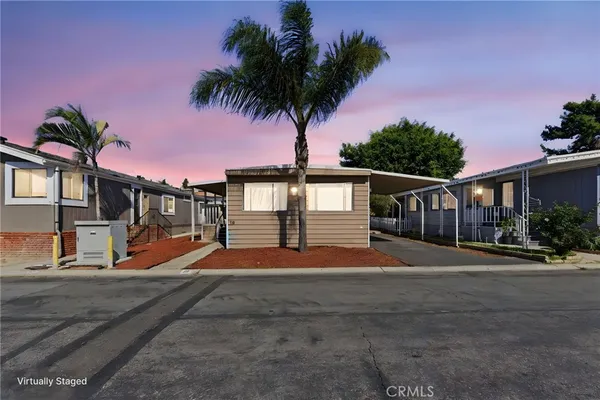 a backyard of a house with wooden fence