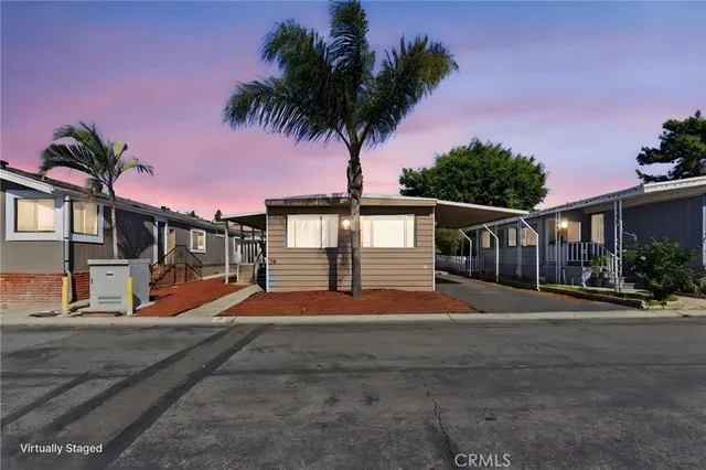 a backyard of a house with wooden fence
