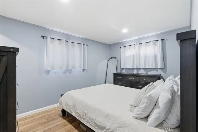 a bedroom with a large bed and a closet