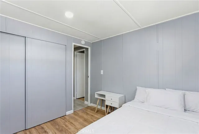 a bedroom with two beds and painted walls