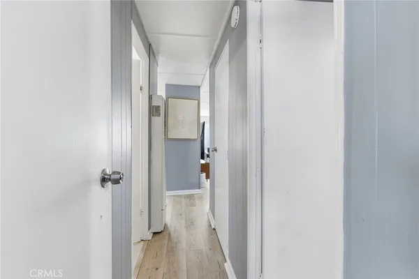 a view of a bathroom from a hallway