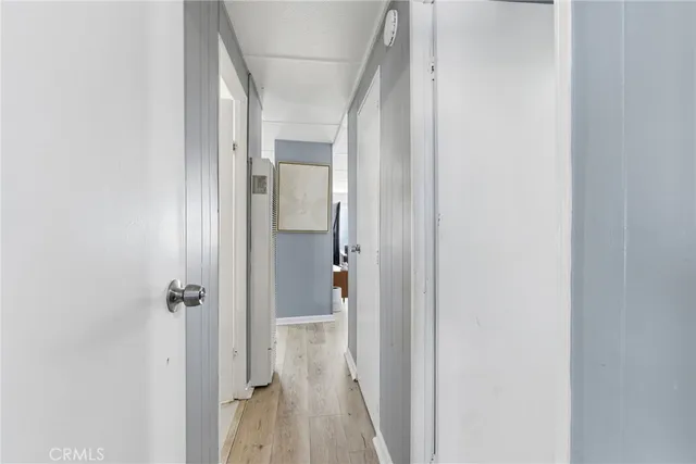 a view of a bathroom from a hallway