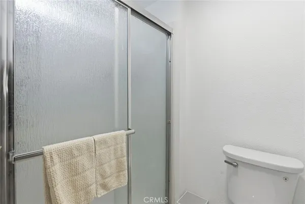 a bathroom with a white toilet