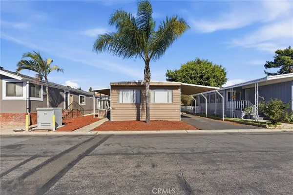 a backyard of a house with wooden fence