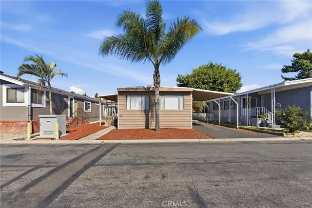 a backyard of a house with wooden fence