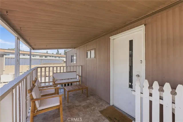 a view of a porch with furniture
