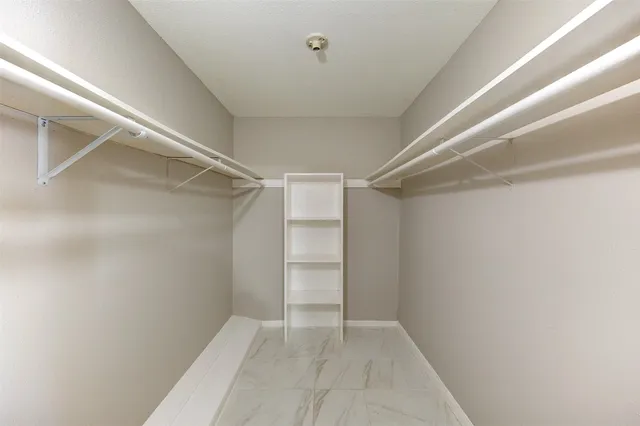 a view of an empty walk in closet