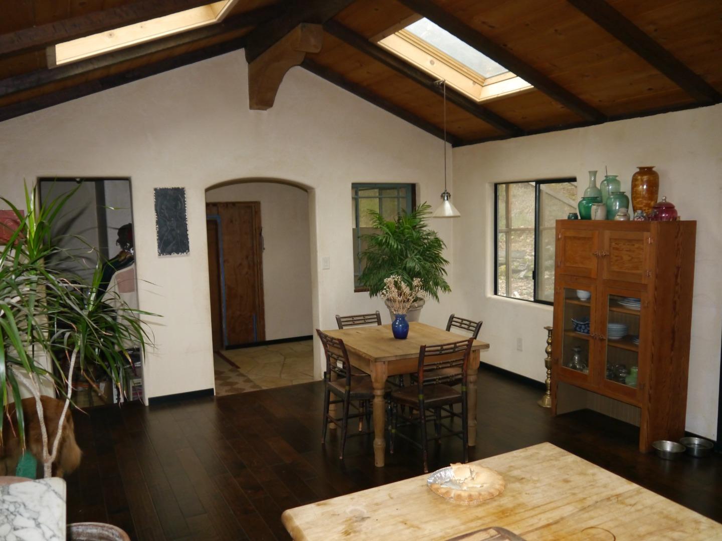 39450 Tassajara Road Carmel Valley, CA 93924 - Photo 11 of 61 a bedroom with furniture and a potted plant