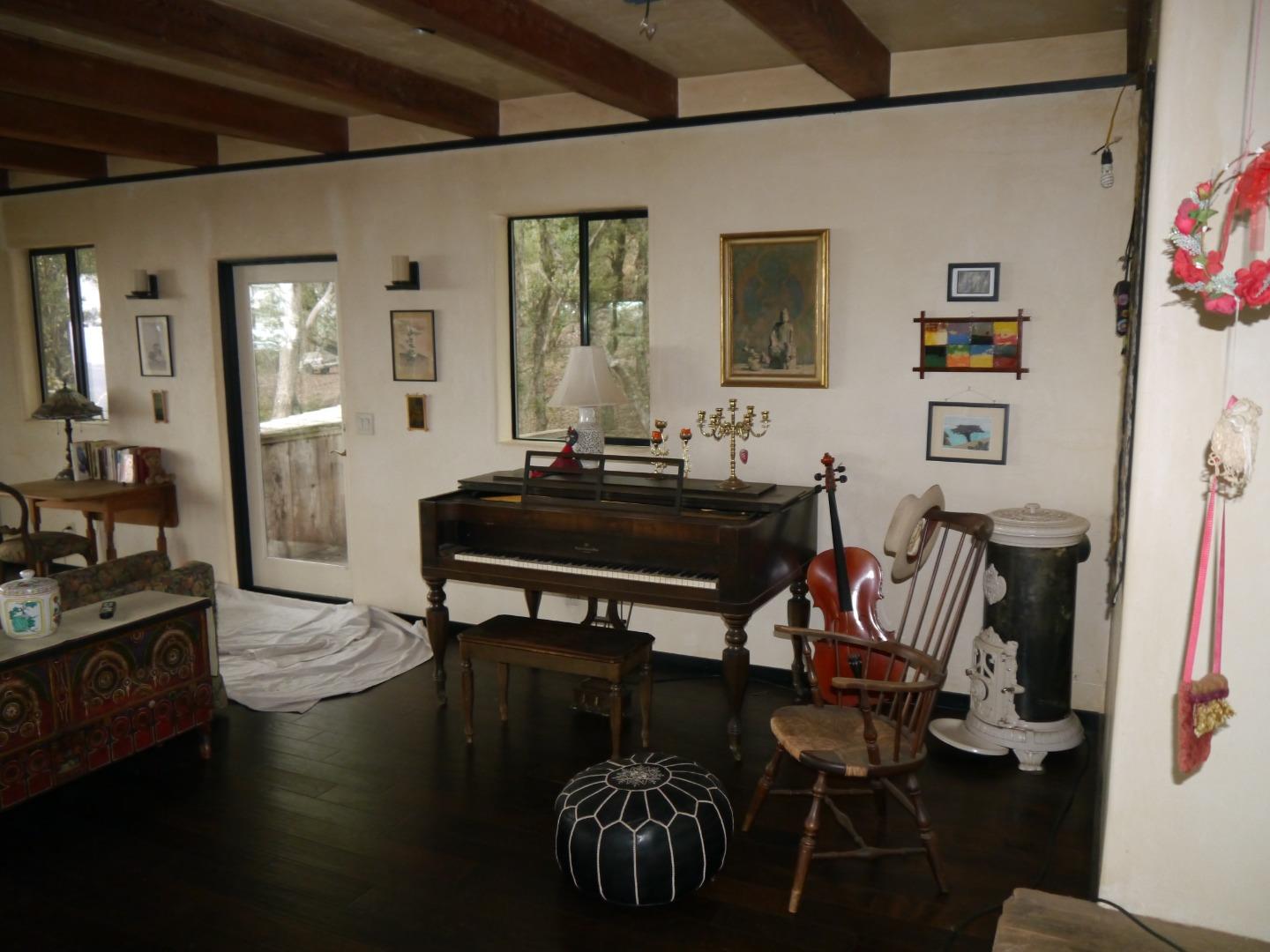 39450 Tassajara Road Carmel Valley, CA 93924 - Photo 16 of 61 a living room with furniture and wooden floor