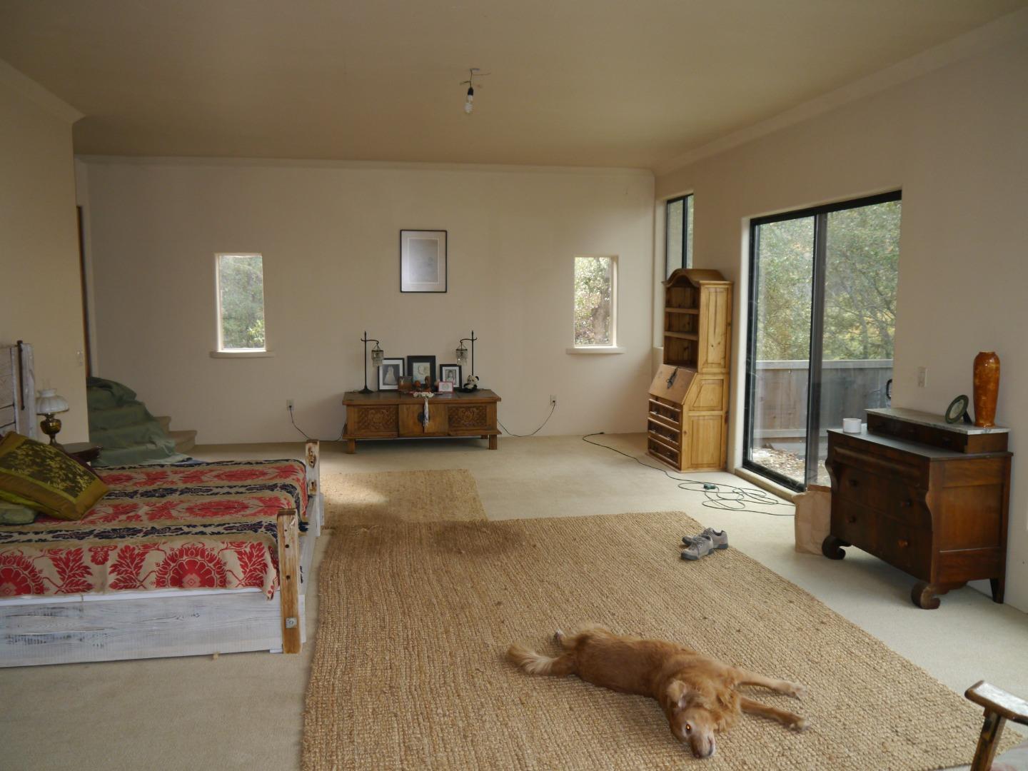 39450 Tassajara Road Carmel Valley, CA 93924 - Photo 18 of 61 a bedroom with furniture and a window