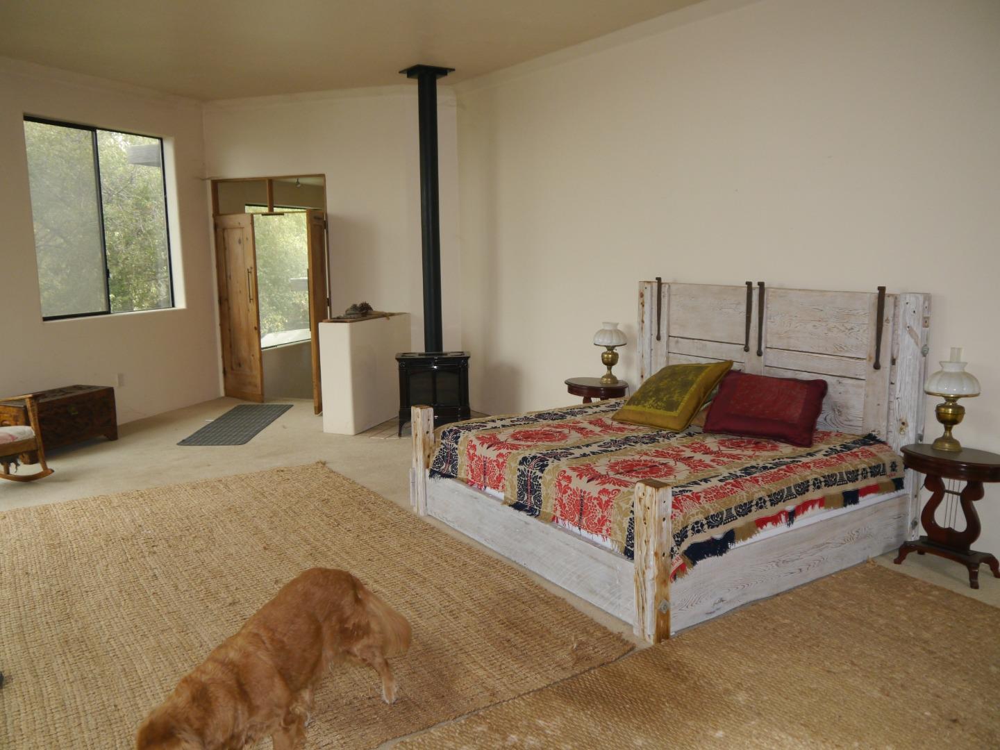 39450 Tassajara Road Carmel Valley, CA 93924 - Photo 19 of 61 a bedroom with a bed and window